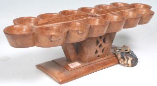 An African tribal Ashanti Ghanaian Manaca game board having fourteen round recesses raised on a