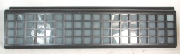 A vintage two part ebonised wooden frame room divider frosted glass panels mounted on heavy circular