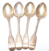 A set of four 19th Century Georgian silver fiddle pattern spoons having matching engraved initials