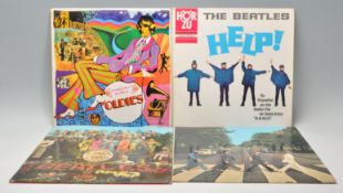 A group of four vinyl long LP record albums by the Beatles to include – Sgt Pepper's Lonely Hearts