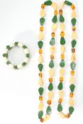 A pair of Chinese style amber jade & ivory style necklaces together with a matching bracelet, both