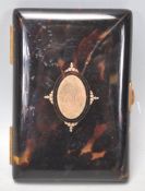 A 19th Century Victorian tortoise shell cheroot / cigarette case having a gilt panel to the front