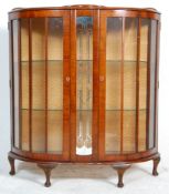A 1930's Art Deco walnut veneered china display cabinet vitrine. Raised on cabriole legs with pad
