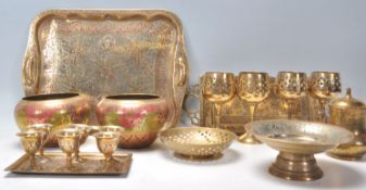 A mixed group of contemporary Eastern brass wares to include a heavy pair of bowls with painted