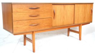 Avalon Furniture - A mid century teak wood sideboard credenza being raised on tapering legs with a