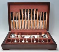 A mahogany cased silver plate six person canteen of cutlery by Sheffield Cutlery with the knife's