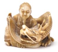 An antique Chinese ivory Netsuke toggle intricatel