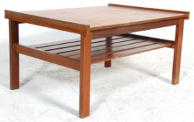 A retro mid 20th Century teak wood coffee table of square form having raised ends with slatted