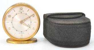 A 1960's Jaeger Le Coultre mid century travel alarm clock complete in the original suede travel case