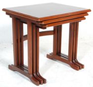 G Plan - A retro 20th Century mahogany nest of tables raised on shaped supports with each having a