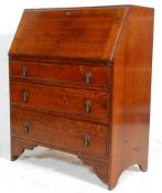 An early 20th century 1920's oak bureau having a fall front desk opening to reveal a sectional