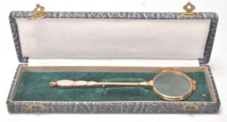 A pair of 20th Century gold plated lorgnettes havi