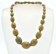 An early 20th Century 1930's early plastic / bakelite graduating beaded necklace with green and