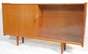 A 1970's retro vintage teak wood sideboard credenza / display cabinet having large glazed sliding