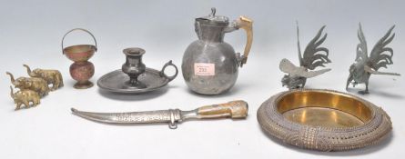 A collection of antique metal ware items to include an Islamic middle eastern curved blade dagger