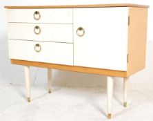 A retro vintage 20th Century white melamine sideboard credenza of good small proportions having a