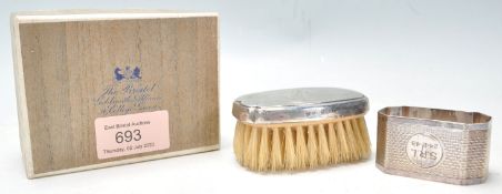 Two 20th Century silver hallmarked items to include a small silver backed brush (hallmarked