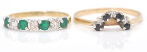 A hallmarked 9ct gold emerald and diamond 7 stone ring. The emeralds and diamonds of mixed cut.