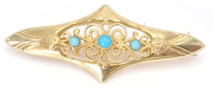 A 9ct gold / 375 marked turquoise bar brooch clip. The brooch with filigree pierced setting having