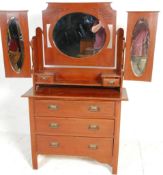A 19th Century Victorian mahogany dressing table chest of drawers having a tri fold mirror top