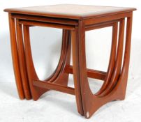 A 1970's G-Plan ' Astro ' teak wood nest of tables. The tables of graduating form with each being