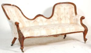 A 19th century Victorian mahogany double scroll end Chesterfield conversation sofa settee. Raised on