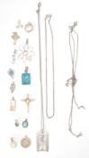 A mixed group of silver pendants and necklace chains to include an engraved heart locket, mother