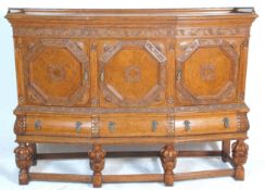 A good 1930's large early 20th Century Elizabethan style oak court cupboard sideboard raised on four