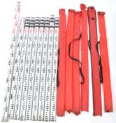 A collection of  six 20th century aluminium three section extending surveyors measures with metal