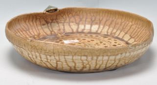 A mid century studio pottery centre piece bowl - fruit bowl having drip glaze decoration with