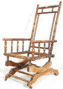 A Victorian 19th century walnut Boston rocking chair / armchair raised on angled sprung supports