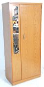 A retro vintage 20th Century teak melamine effect wardrobe of good small proportions having a single