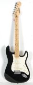 A Fender Stratocaster style Bluerock six string electric guitar having three control knobs with a