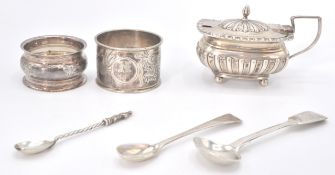 A group of silver hallmarked wares to include a late Victorian mustard pot raised on ball feet,