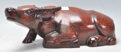 A 20th Century Chinese carved hardwood figurine in