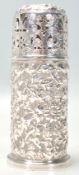 An antique Victorian hallmarked sterling silver repousse sugar shaker of cylindrical form