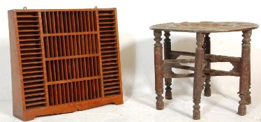 A 20th anglo-colonial revival brass wire inlaid  tape rack stand of sectional form with good