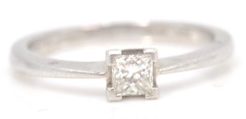 An 18ct white gold princess cut diamond with a four prong setting. Weighs 3.5g Size 5.L.