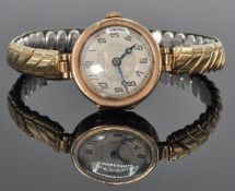 An early 20th Century Art Deco 9ct yellow gold ladies wrist watch having a decorative face with