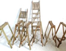 A set of six 20h Century industrial wooden trestles / table stands together with two vintage folding