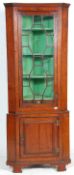 A 19th century mahogany George III bookcase corner