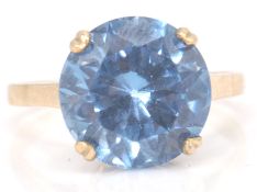 An impressive yellow gold ring with a substantial princess cut aquamarine stone of approx 6cts