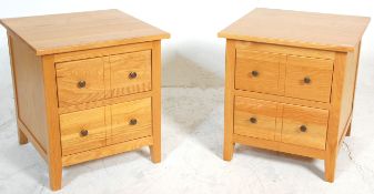 A modern contemporary pair of hardwood DFS bedside chests of drawers  / tables. Each raised on