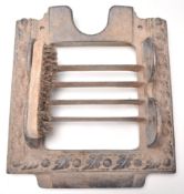 A Victorian 19th century cast iron bootscrape. The cast iron scrape with rococo design having a