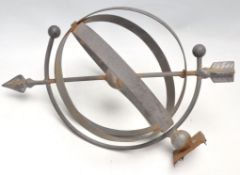 A bent metal Orrary garden ornament feature.