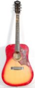 A good quality Hustler made six string acoustic guitar having a sunburst body with floral