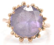 A 14ct gold ladies dress ring prong set with a lar