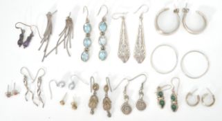 A good mixed group of ladies silver earrings to include hoop examples, pierced drop panel