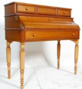 A contemporary French fruitwood bonheur de jour - secretaire / bureau desk. The bureau having a