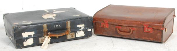 Two vintage retro mid 20th Century leather cased travelling suitcases / trunks to include a faux